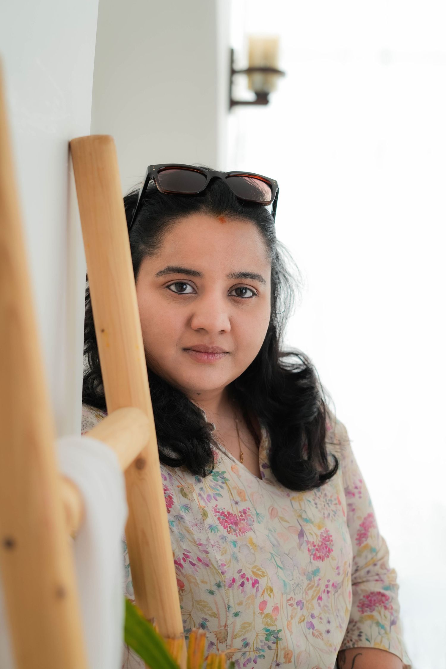 Portrait of Sai Jyothi, founder of Bump To Baby, a maternity, newborn, and family photography studio known for calm, emotional storytelling.