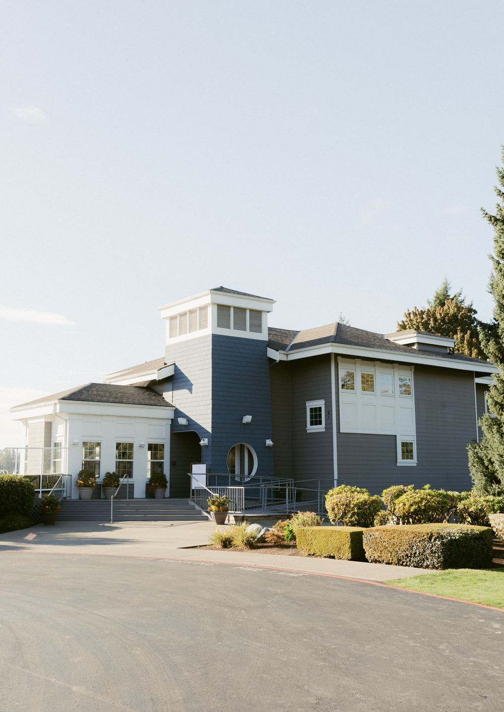 Modern gray and white medical office buildings with parking lots and landscaping in a suburban setting.