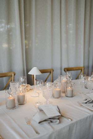 Elegant wedding table setting with neutral linens and refined styling.