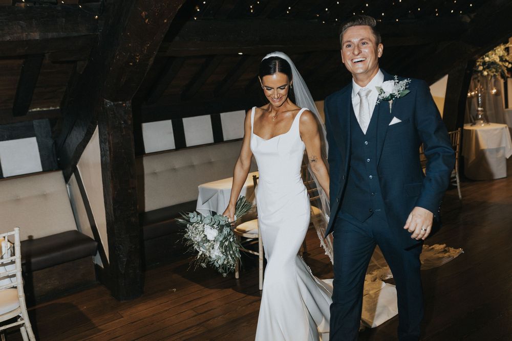 rivington hall barn wedding photography. bride groom entrance