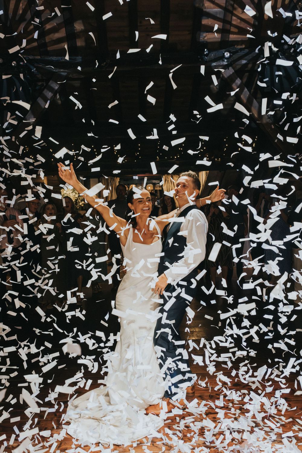 rivington hall barn wedding photography bride groom confetti canons