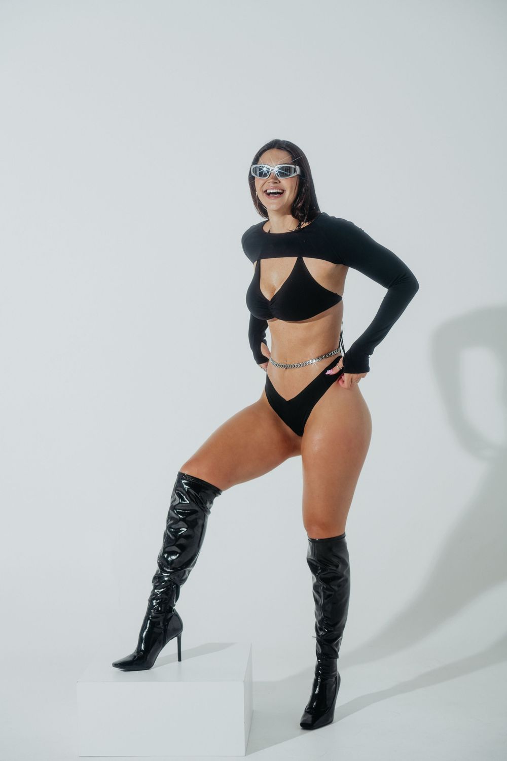 Creative Boudoir Photoshoot of woman dressed like she is in the matrix.