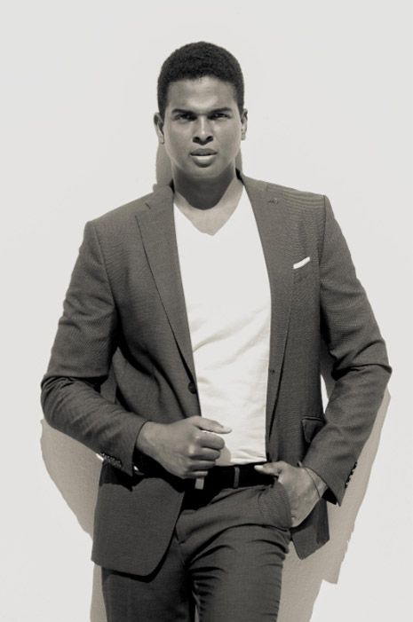 Man in gray suit and white shirt poses in three similar black and white portraits. Photo session.