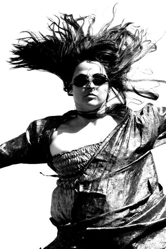 A dramatic black and white sequence shows a figure with windswept hair in motion against a stark background. Buenos Aires Candelaria Frias