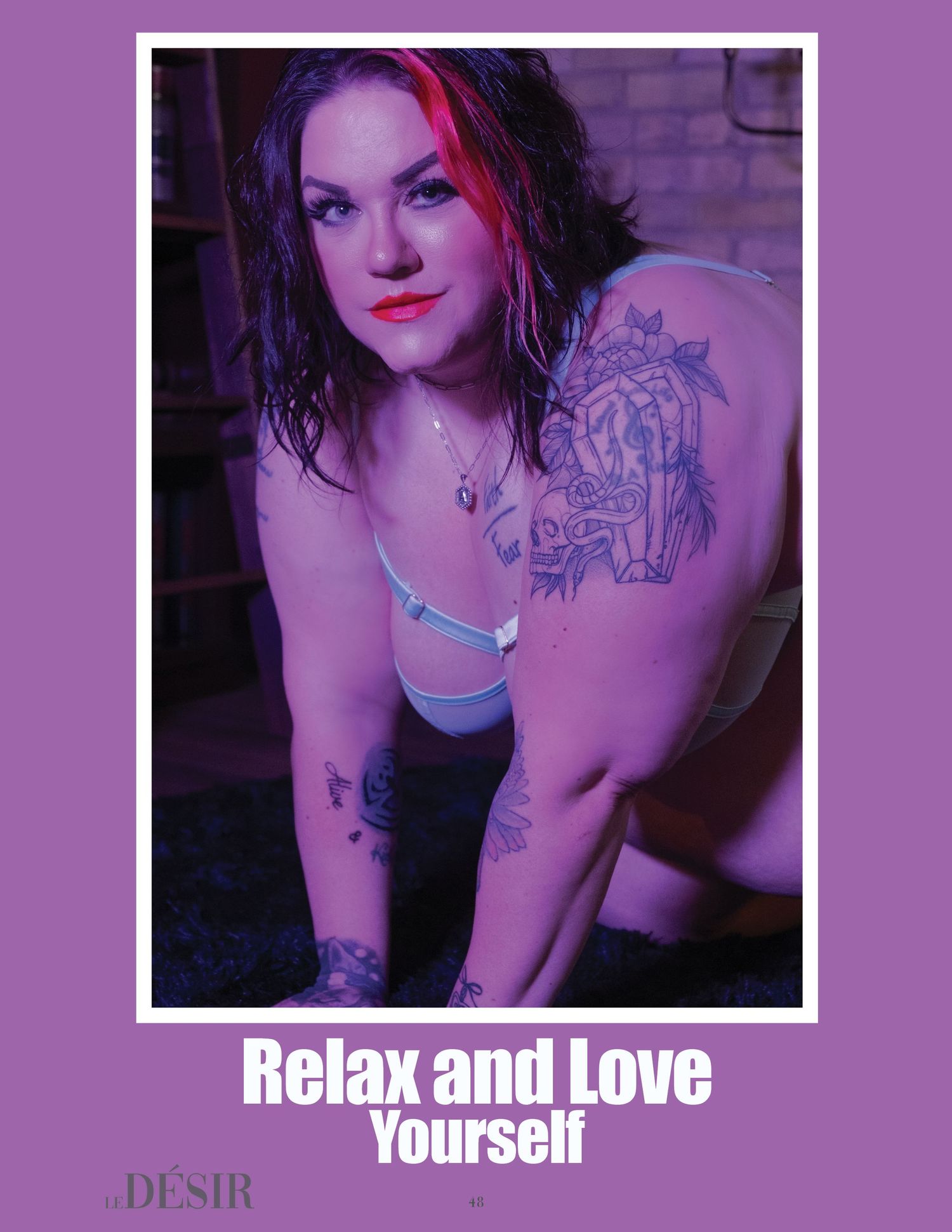 Portrait photo with purple lighting showing tattoos against a brick wall background and text saying 'Relax and Love Yourself'.