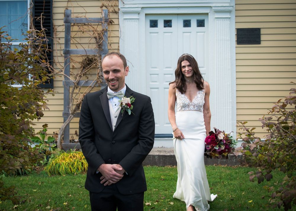 A series of wedding photos taken against a white door and beige house exterior.