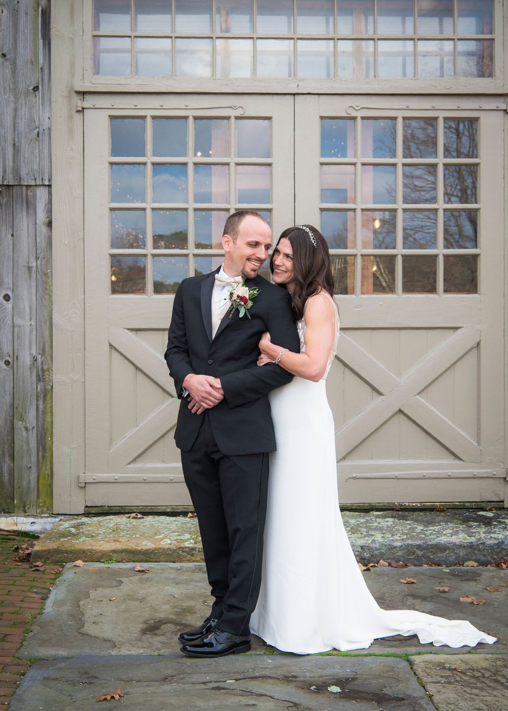 Series of outdoor wedding photos against weathered garage doors.
