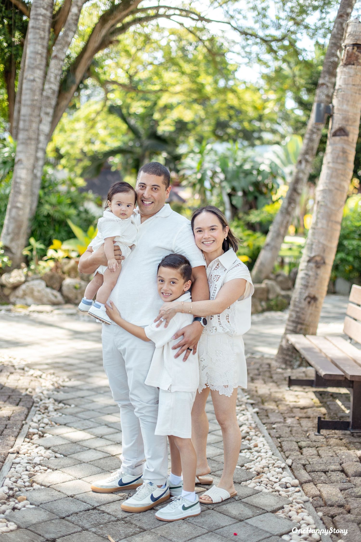 Family portrait session at Cove Gardens and Resort featuring parents and children sharing natural smiles and candid moments.