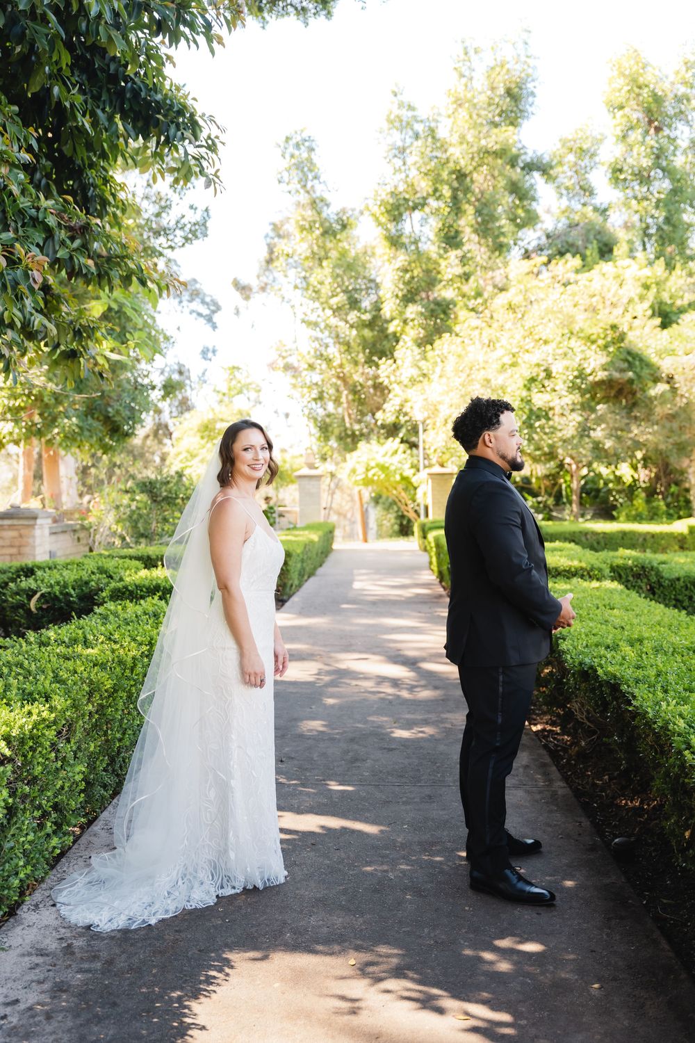 Bride surprises groom with first look at Alcázar Garden in Balboa Park