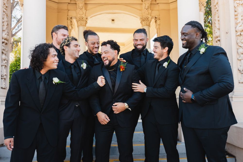Laughing groomsmen portraits at Spreckels Organ Pavilion in Balboa Park