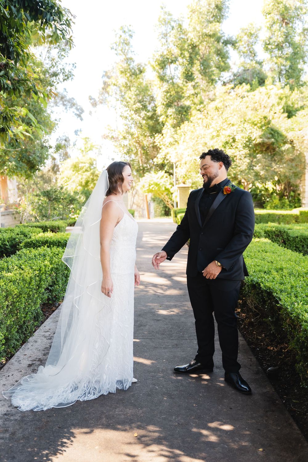 Bride and groom first look at Alcázar Garden in Balboa Park
