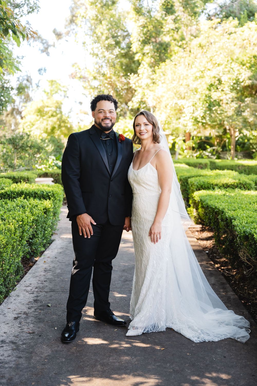 Bride and groom portraits at Alcázar Garden in Balboa Park