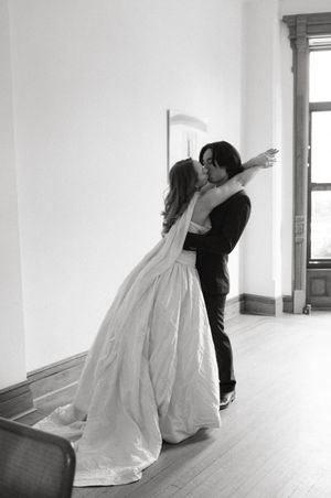 Romantic black and white dance sequence in an empty white room.