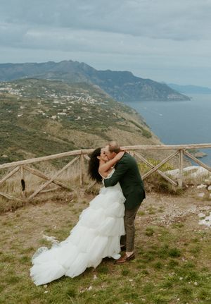 A romantic photo sequence on a scenic mountain overlook with dramatic coastal views.