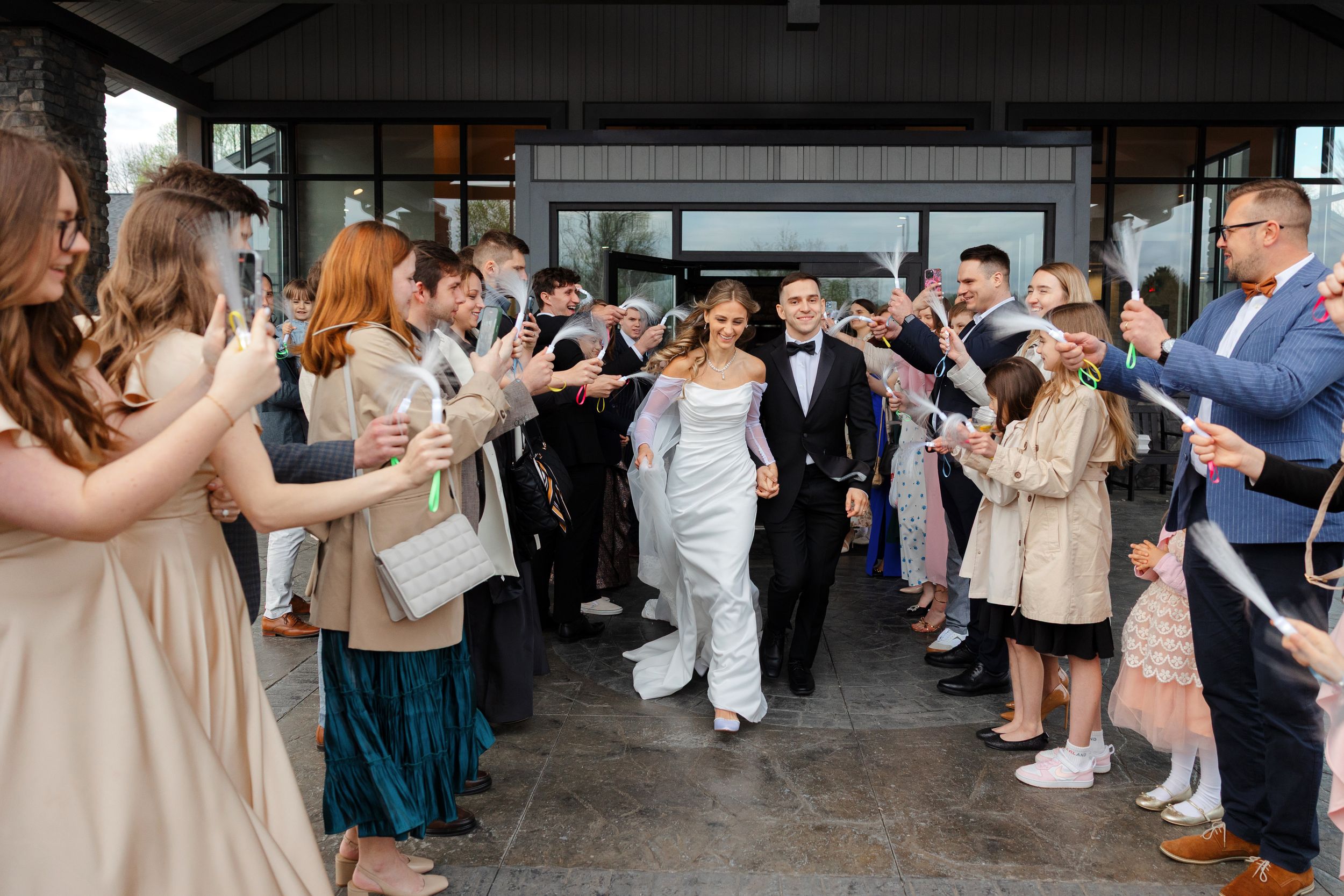 Bride and groom grand exit from Reserve at Stone Creek in North Canton photographed by Tom Forrest from Hudson, Ohio.