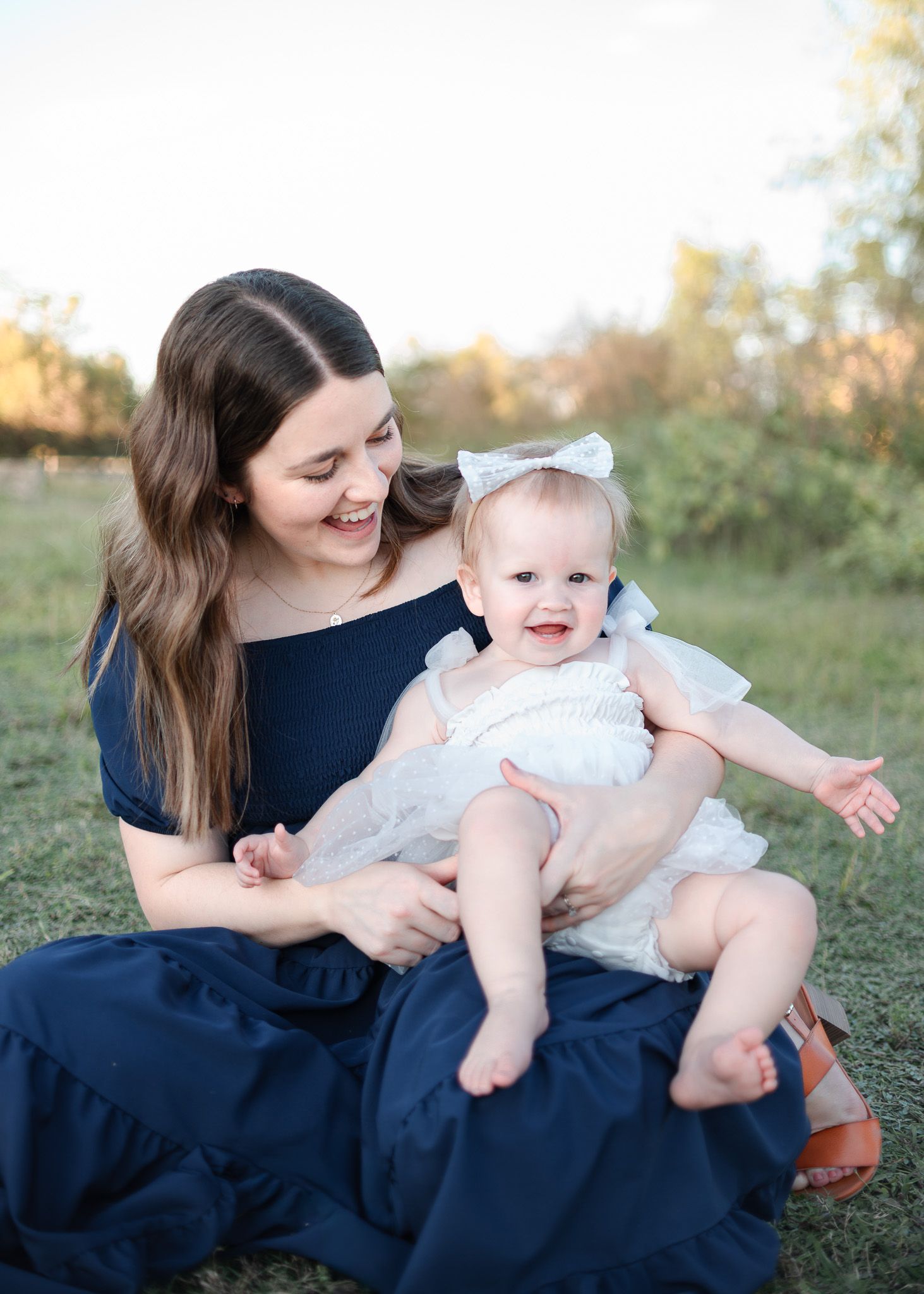 Mom holding baby during family session at Salado Creek with a Belton Texas family photographer