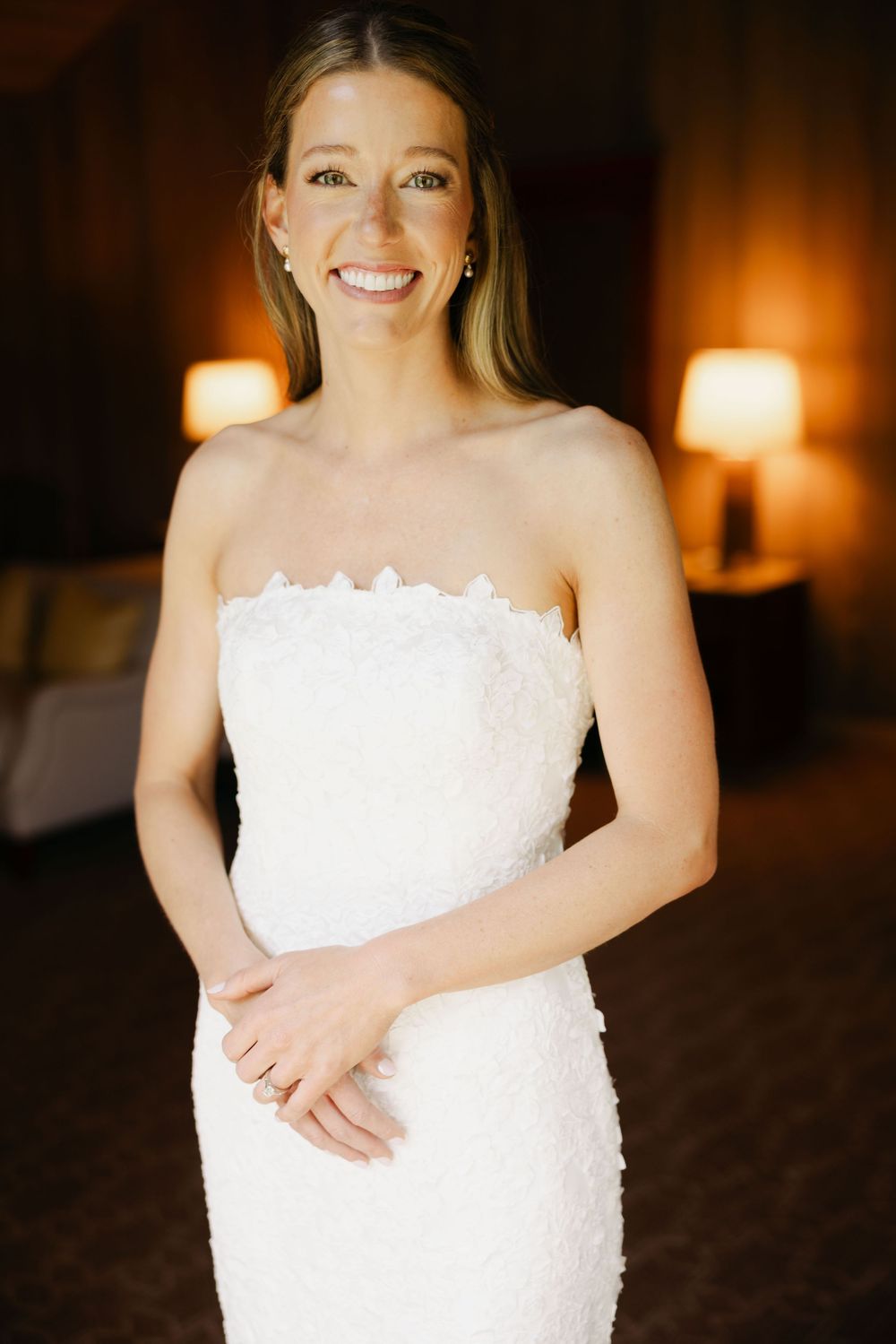 A series of elegant bridal portraits showing a person in a white strapless wedding gown in warm lighting.