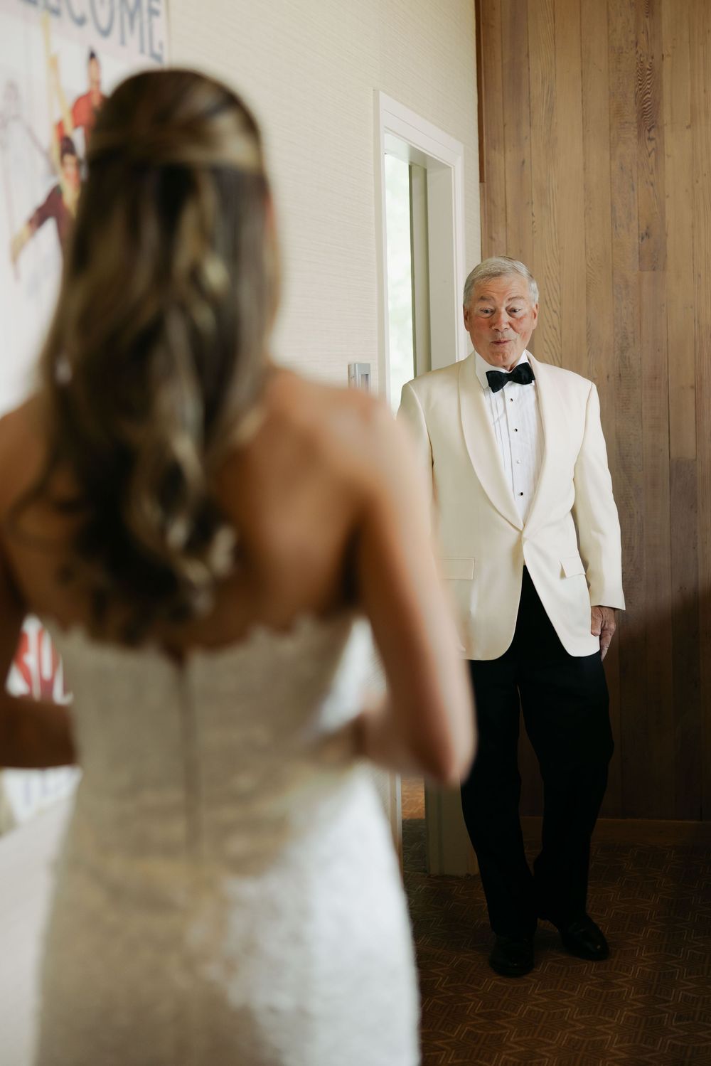 A sequence of wedding photos showing a first look moment between a bride in white and someone in a black tuxedo.