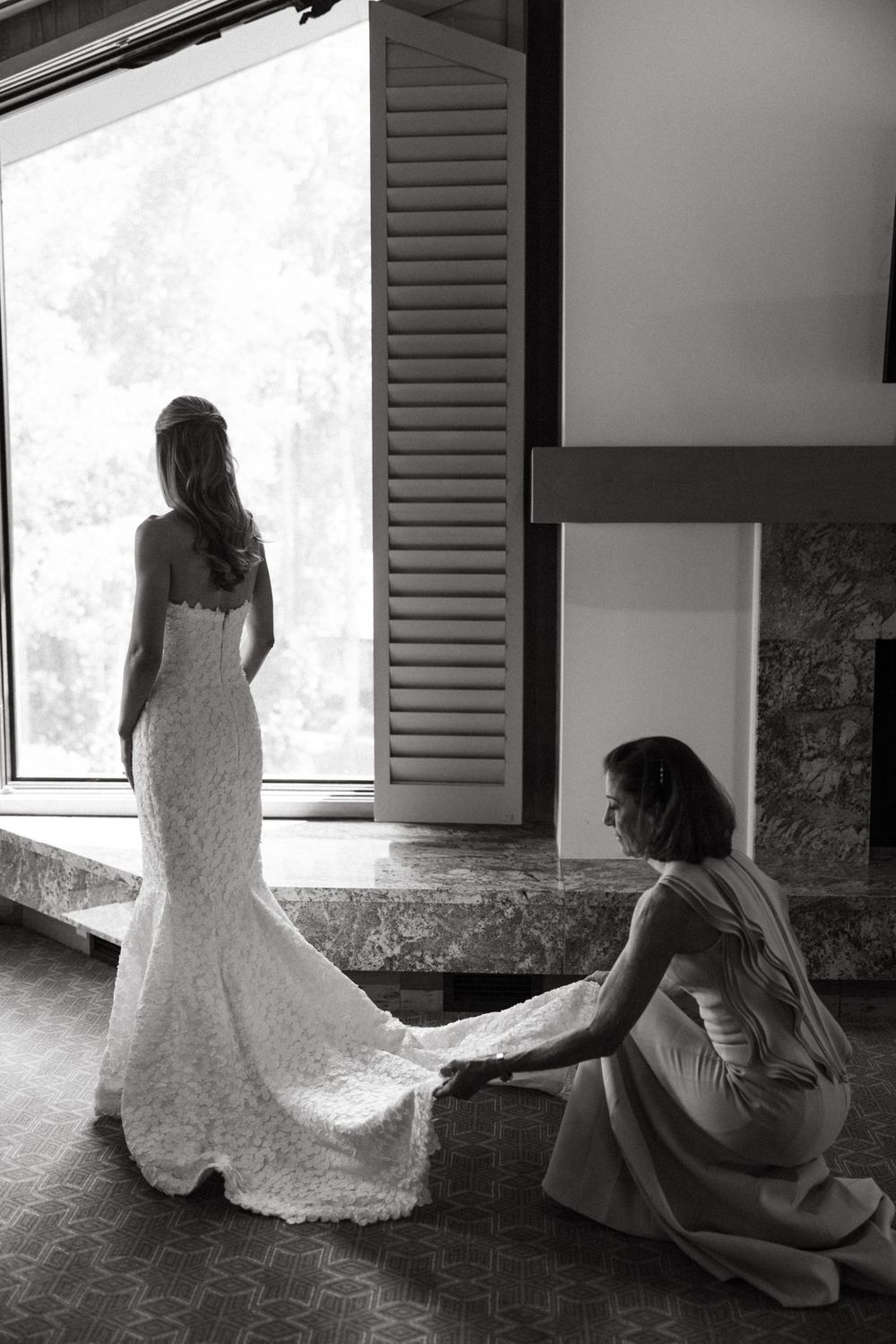A sequence of black and white photos showing a bride in a lace gown sitting by a window in silhouette.
