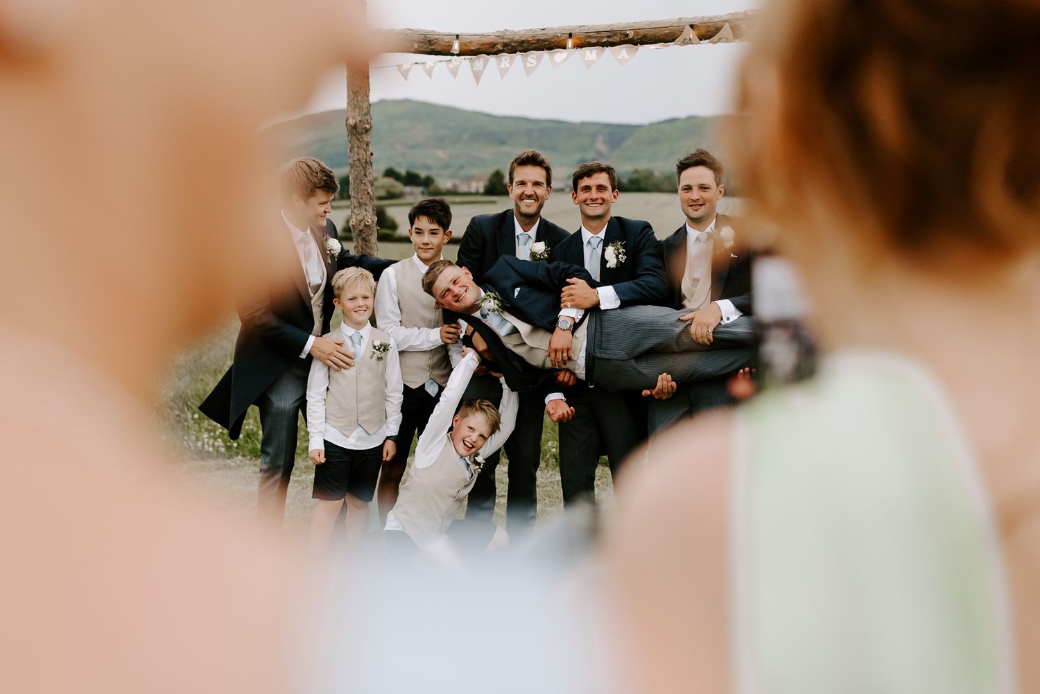 A collection of wedding photos showing joyful moments between couples and guests during outdoor celebrations.