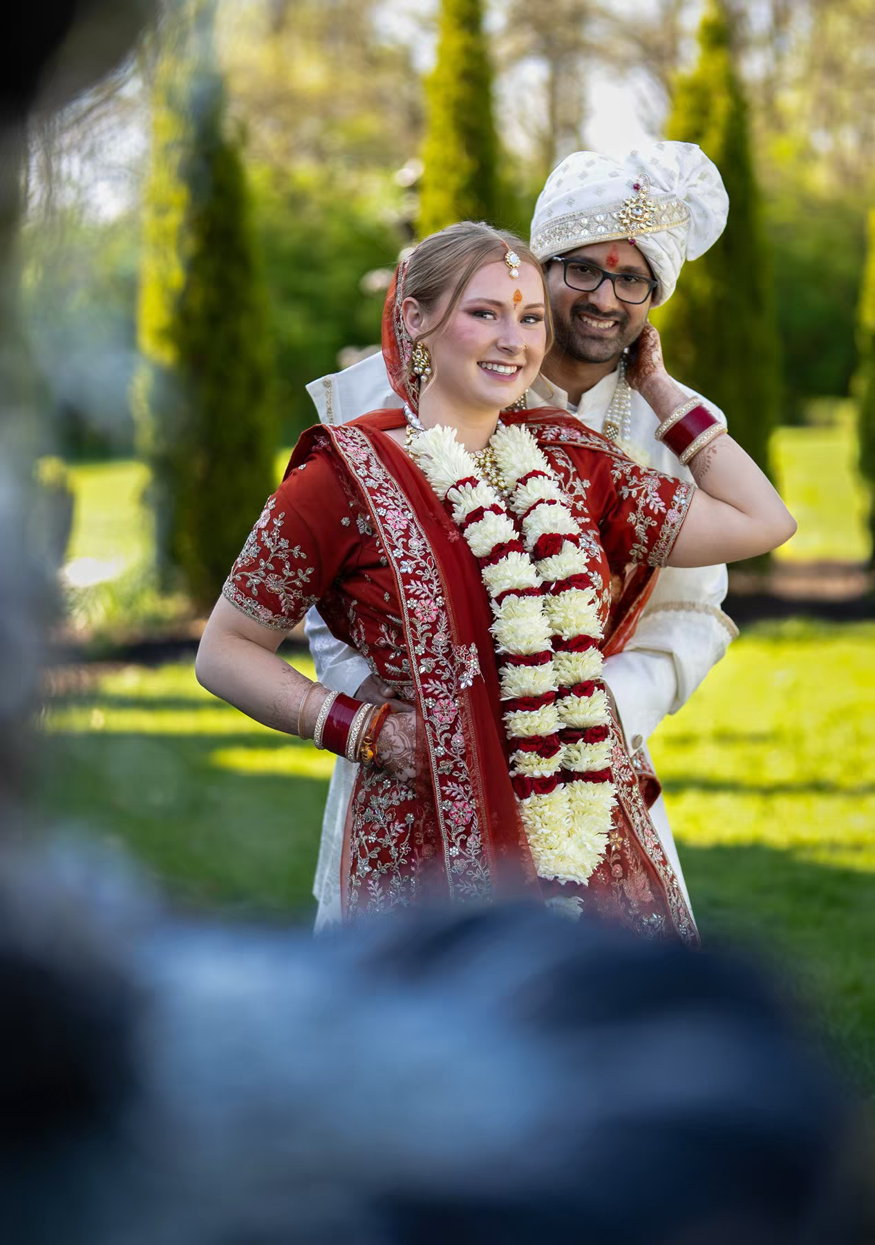 A couple in traditional Indian wedding attire at white willow meadows
