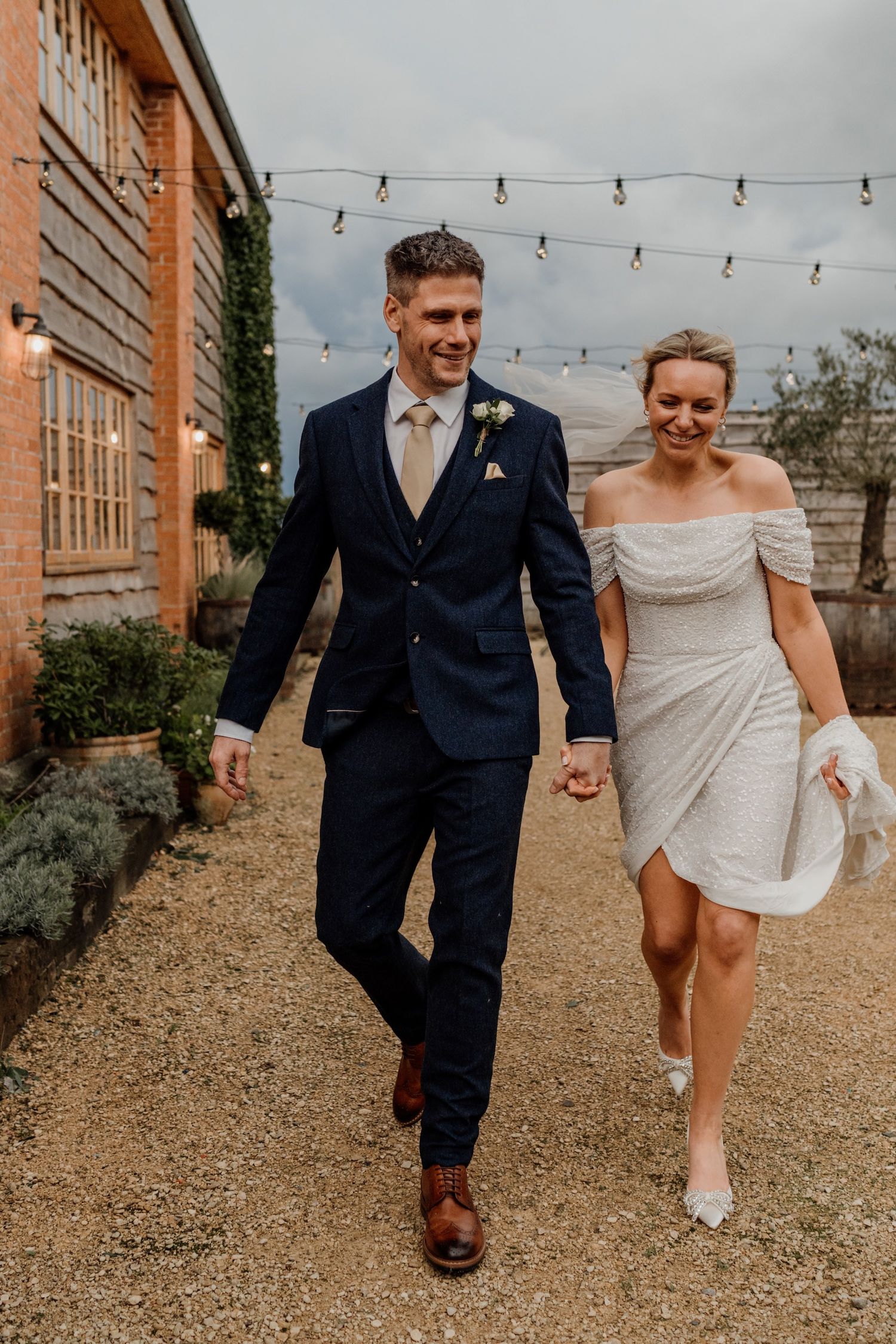 Series of romantic photos showing couples running and walking together outdoors against a brick building.