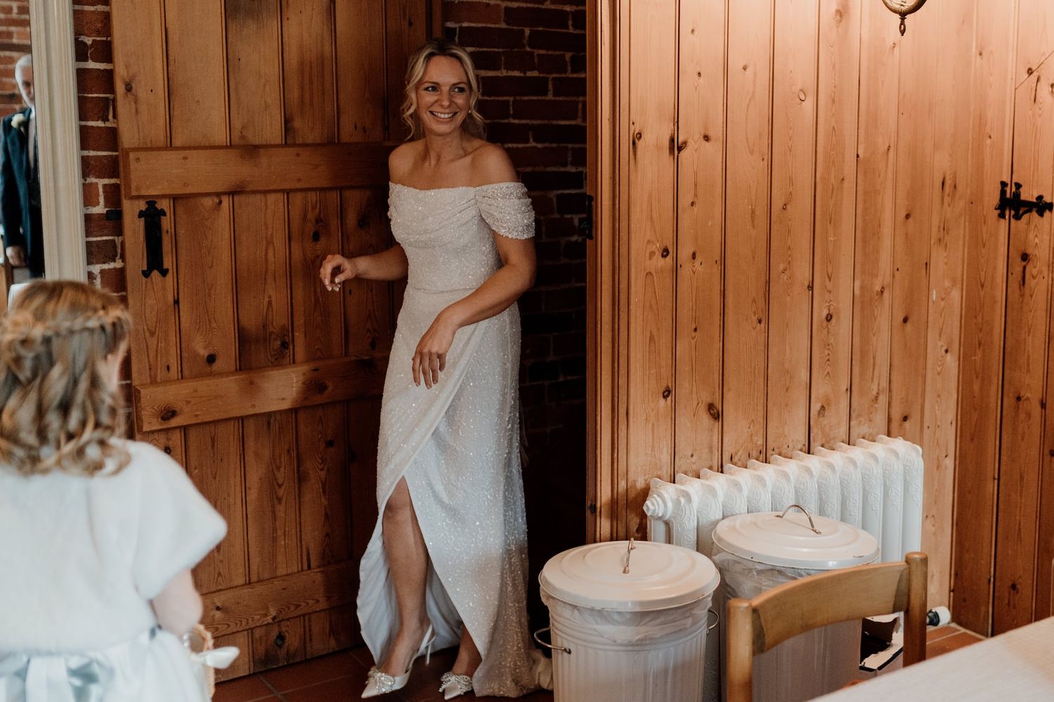 A series of wedding photos showing dance moves in a rustic wooden barn venue.