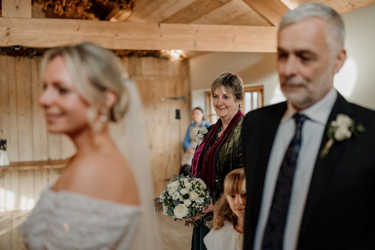 A sequence of candid wedding preparation moments captured in warm wooden interior lighting.
