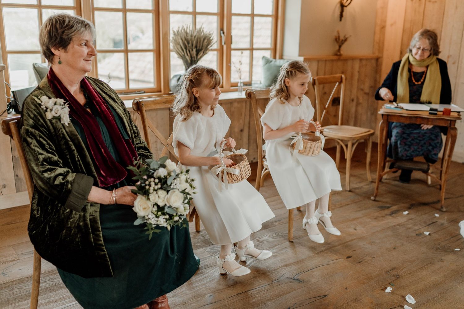 Wedding party celebration photos in a sunlit wooden barn interior.