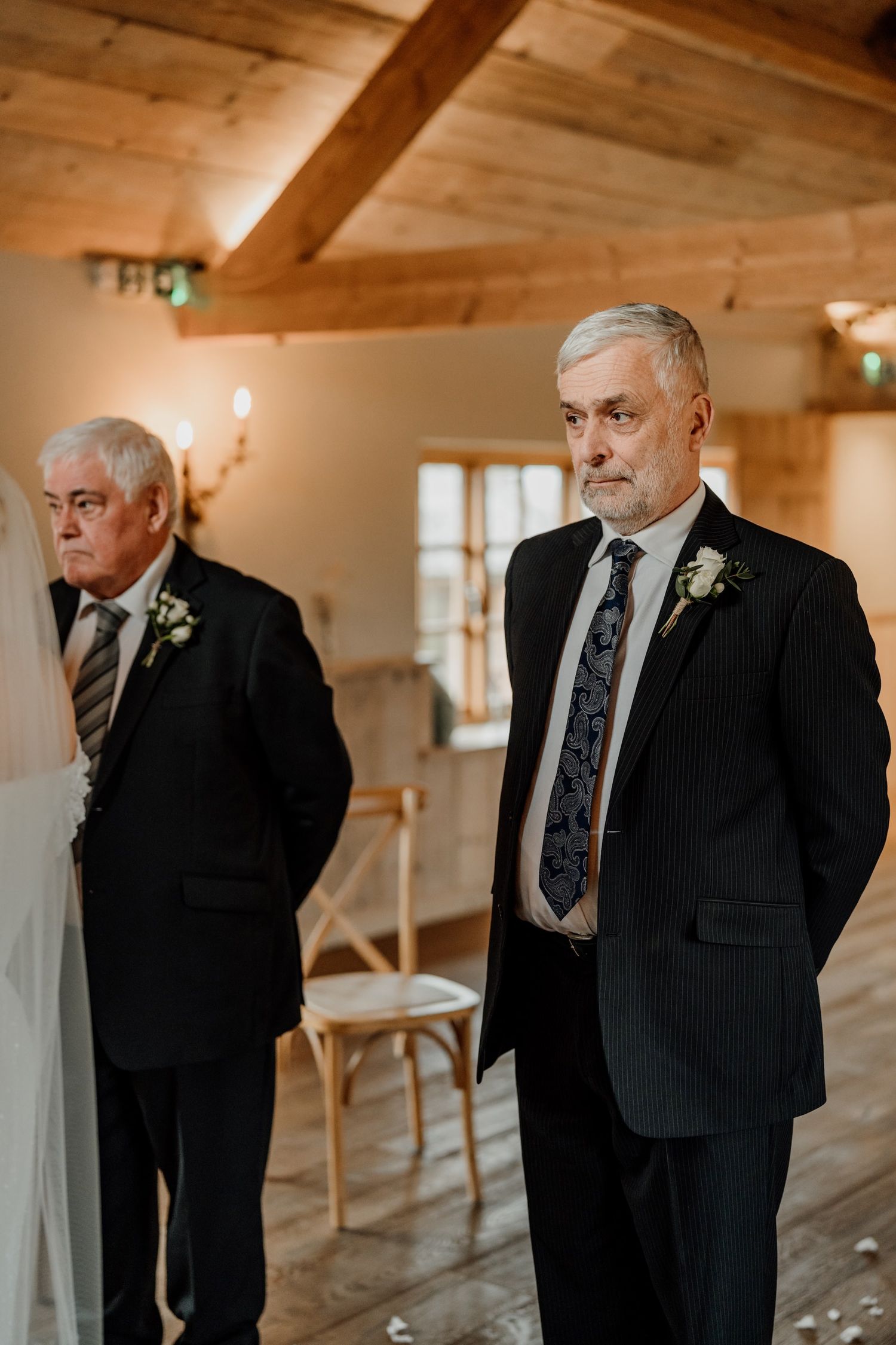 A series of emotional candid shots showing wedding day preparations in a rustic wooden venue.