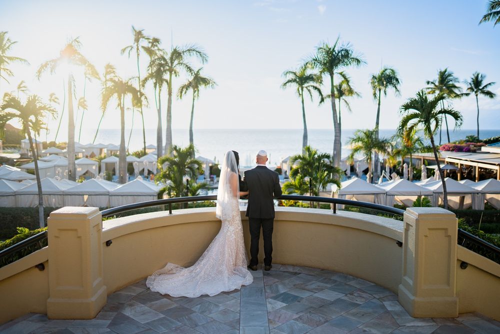 Maui wedding photographer photo against beautiful Maui beach sunset and Four Seasons Resorts by ohwowfotos.