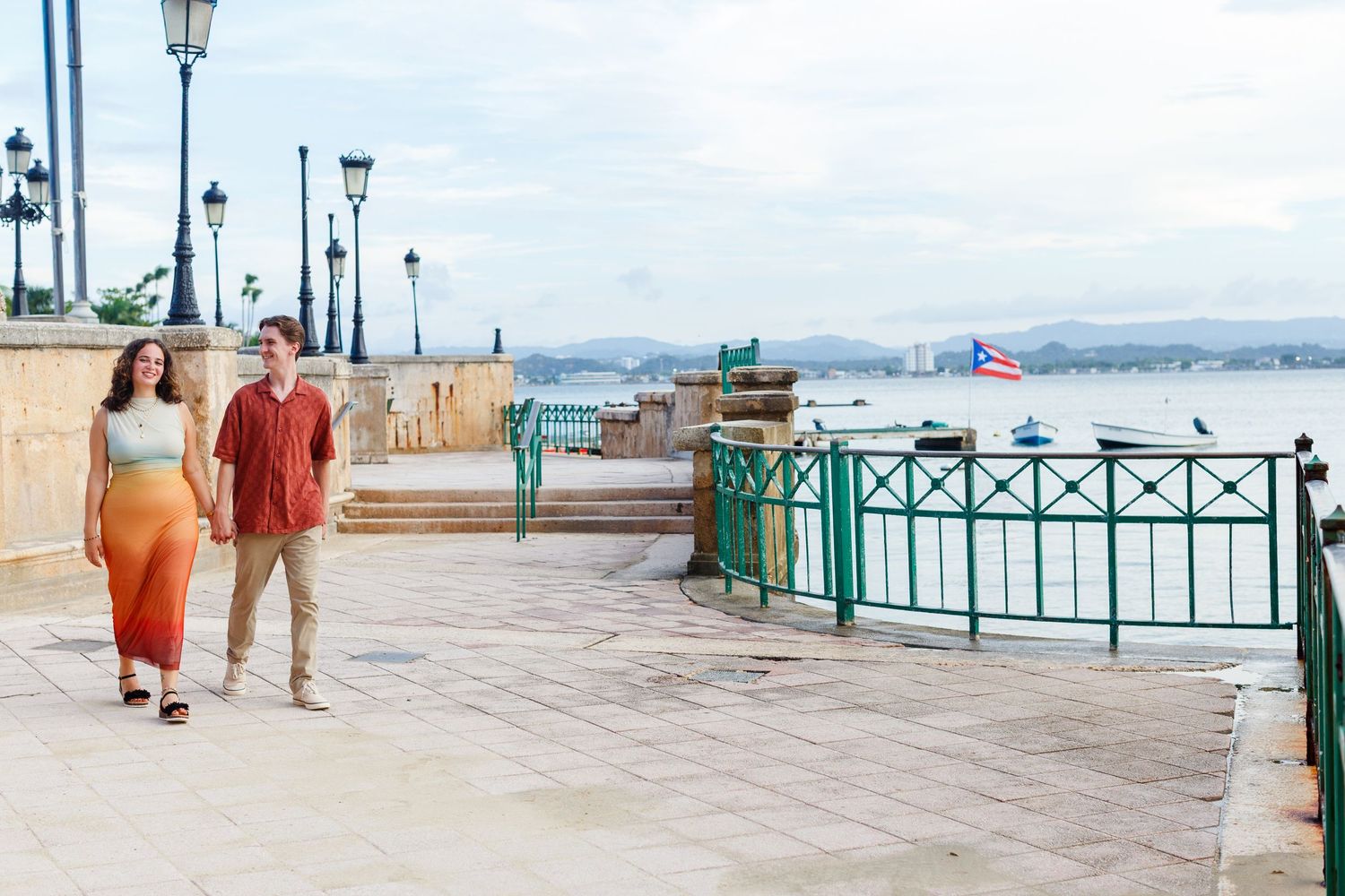 Surprise marriage proposal in Old San Juan, Puerto Rico. Paseo de la Princesa. Man and woman.