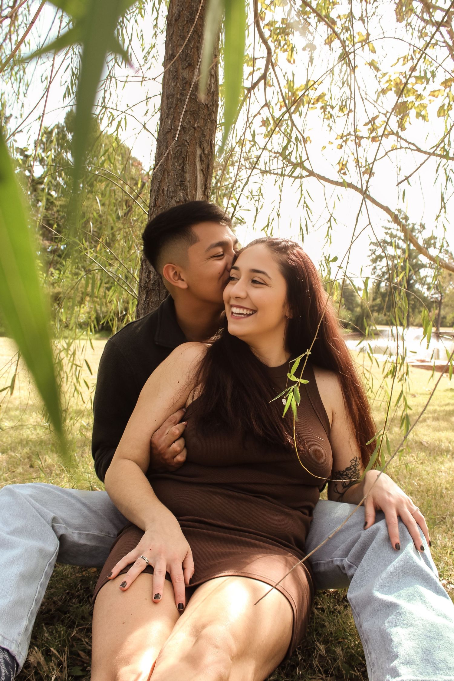 Couple Posing for Photo Under Willow Tree Located in Will Rogers Gardens