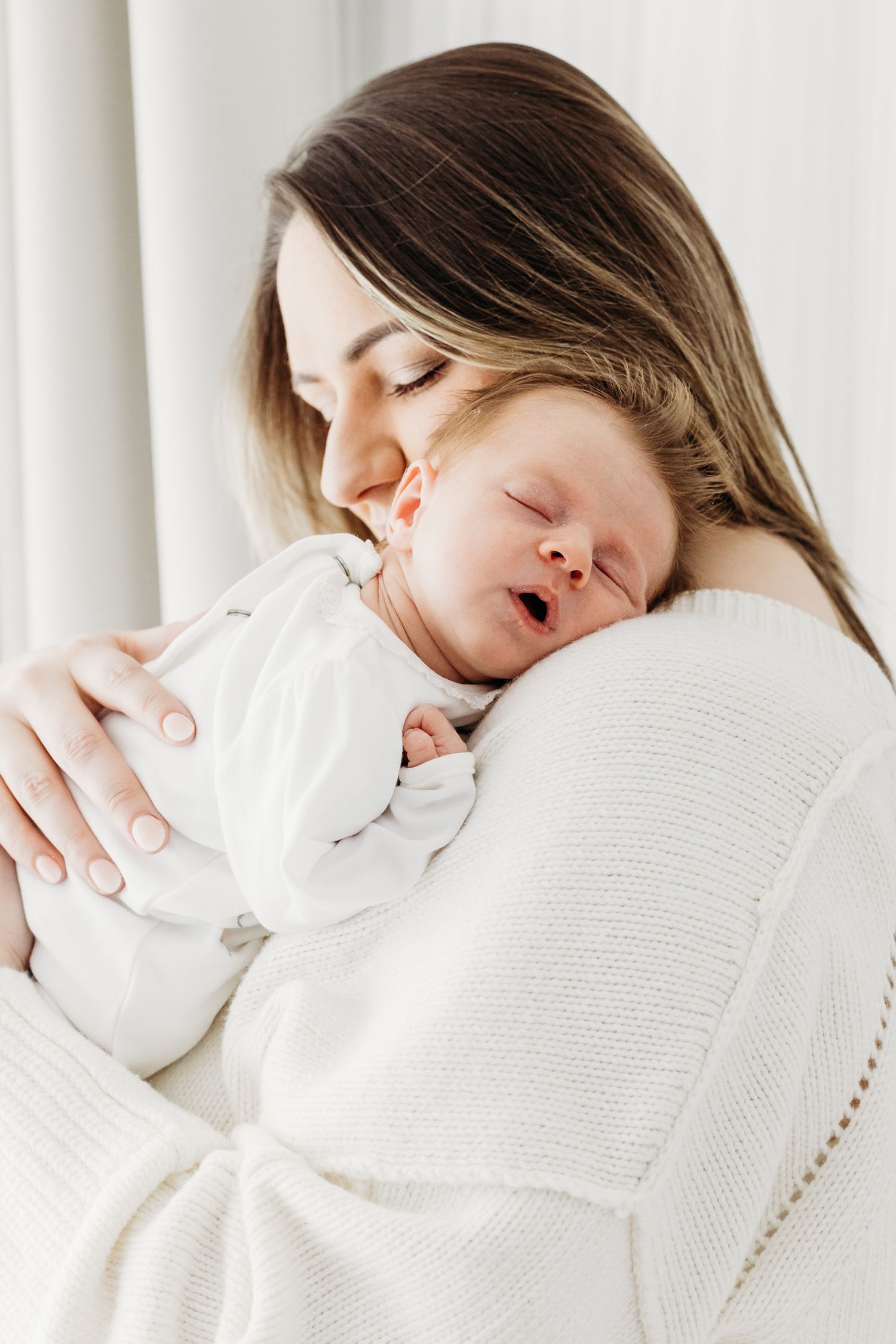 Newborn portraits at Nottingham studio, captured in neutral wraps and soft natural light by Mapperley newborn photographer.