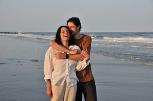 Couple poses during an outdoor couples photography session.