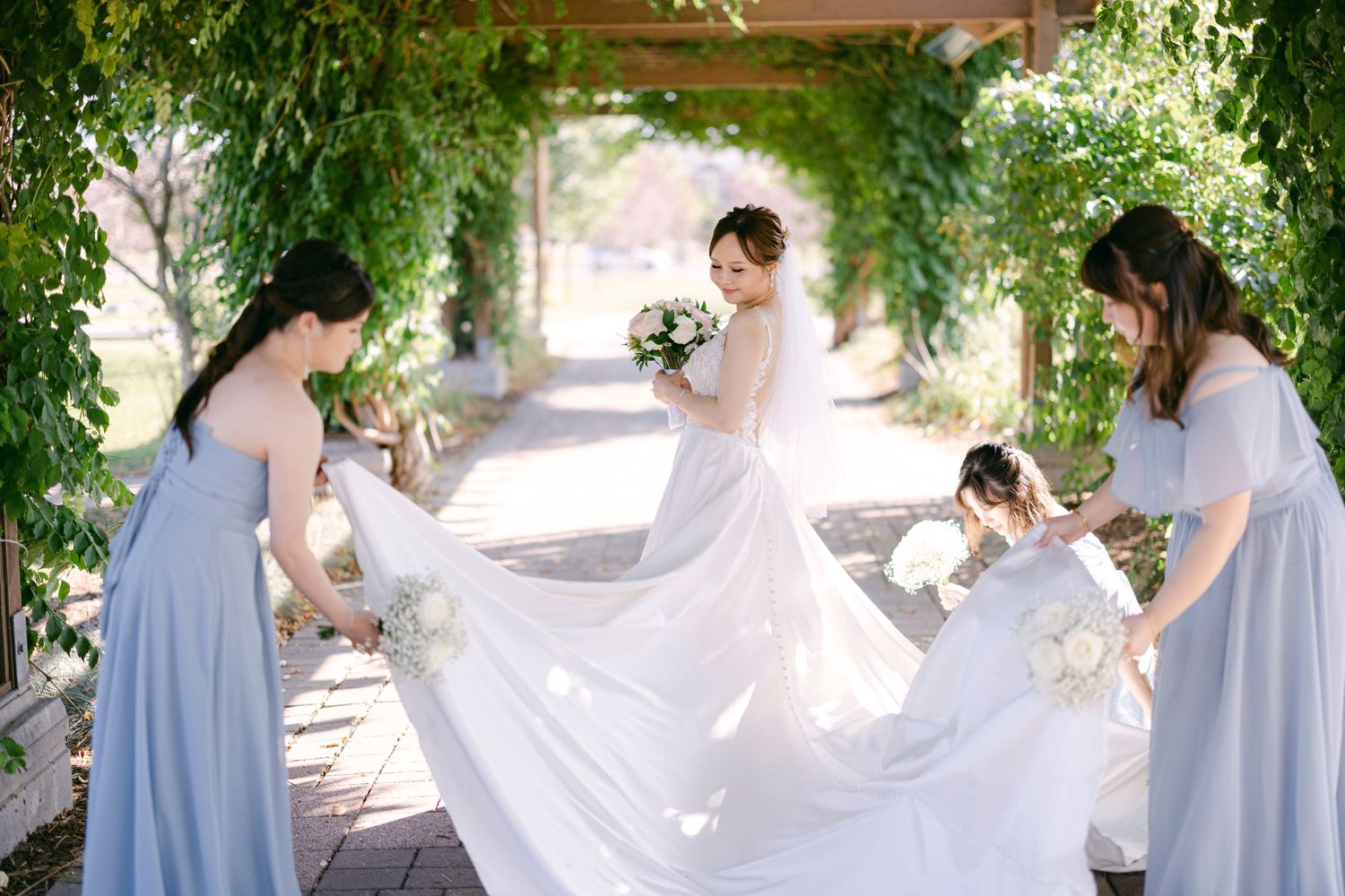 Candid wedding portrait of bride and bridesmaid laughing – Toronto wedding photography