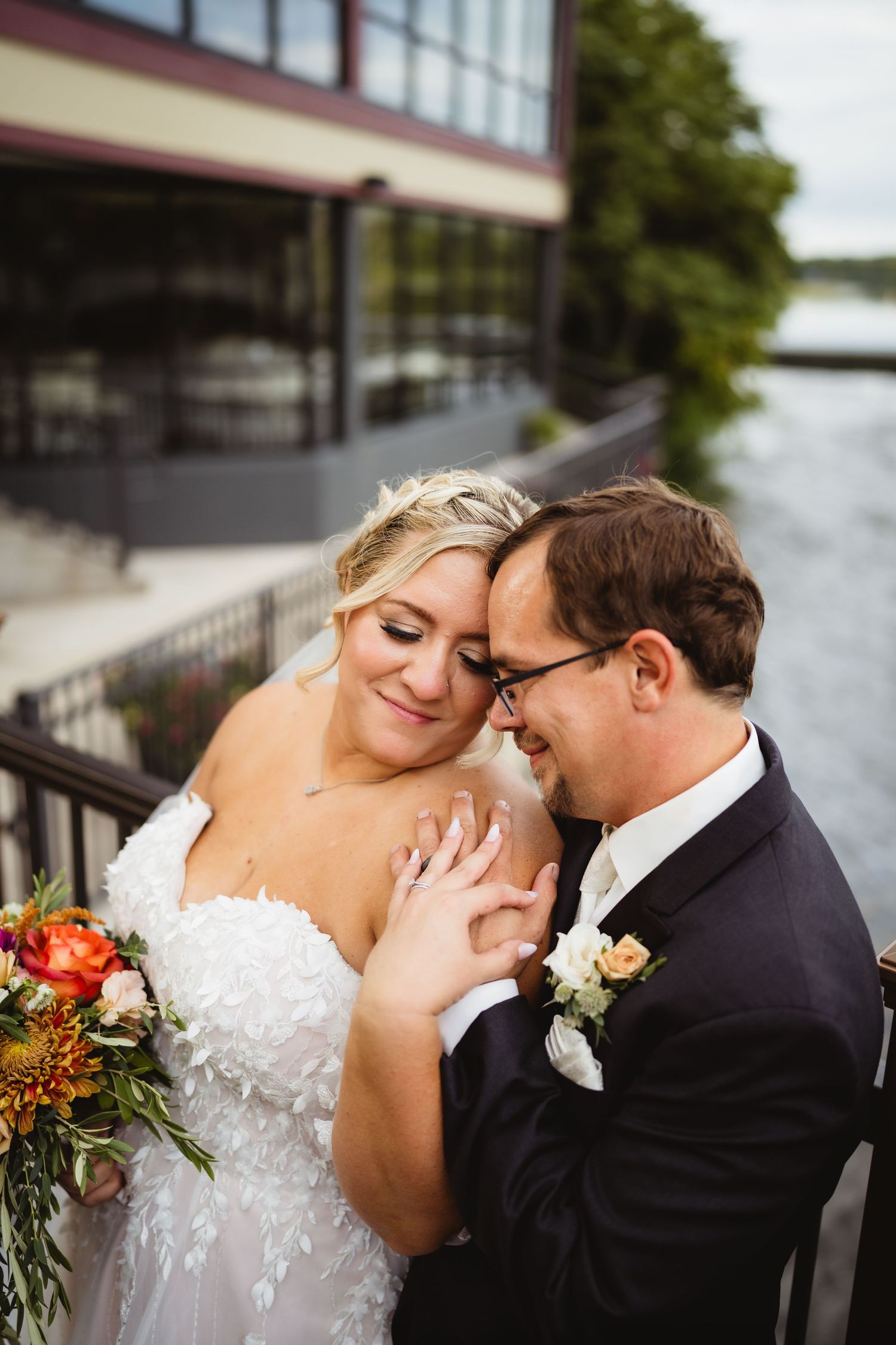 A tender wedding moment captured in a series of romantic outdoor portraits showing an intimate embrace.