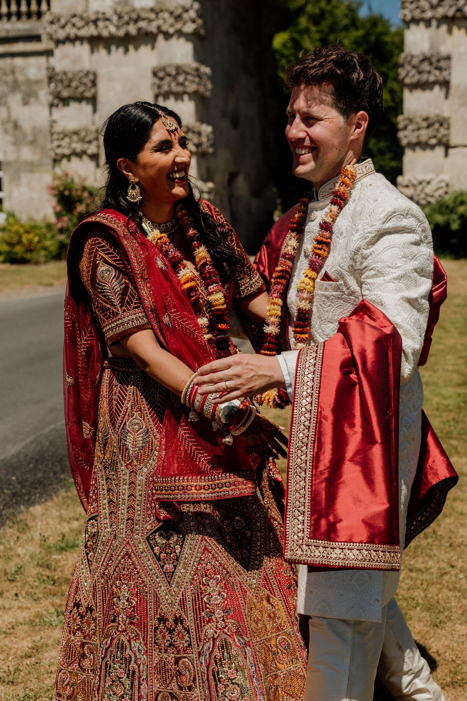A sequence of photos showing a couple in traditional Indian wedding attire sharing joyful moments during their celebration.