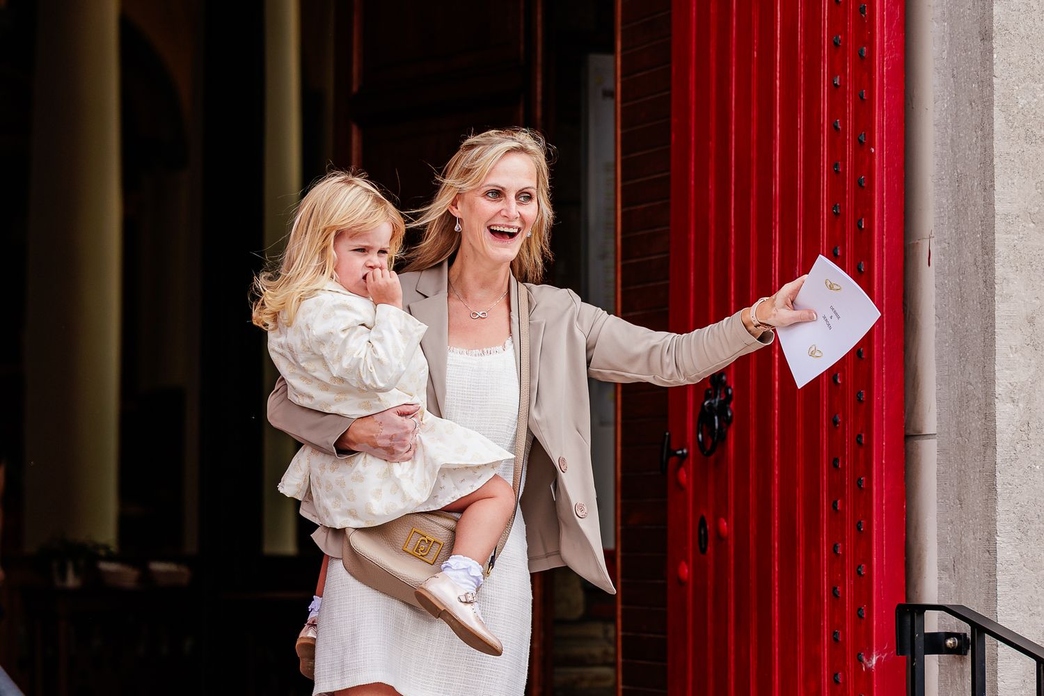 A series of candid moments showing people celebrating joyfully in front of a red door.