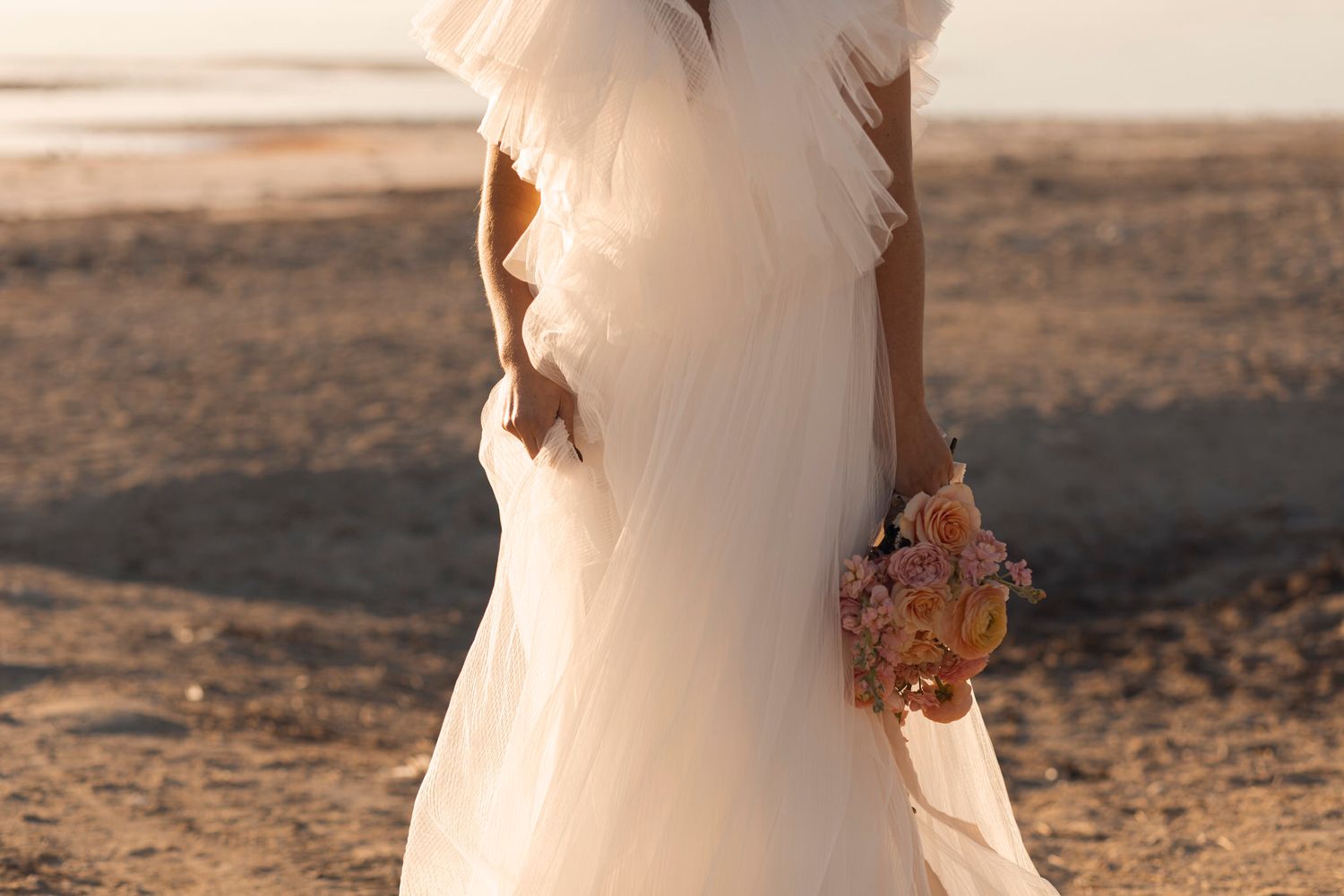 White dress, peach and pink flower detail shot in warm light. How thoughtful visuals drive conversations. Content strategy. Lumenali Photo