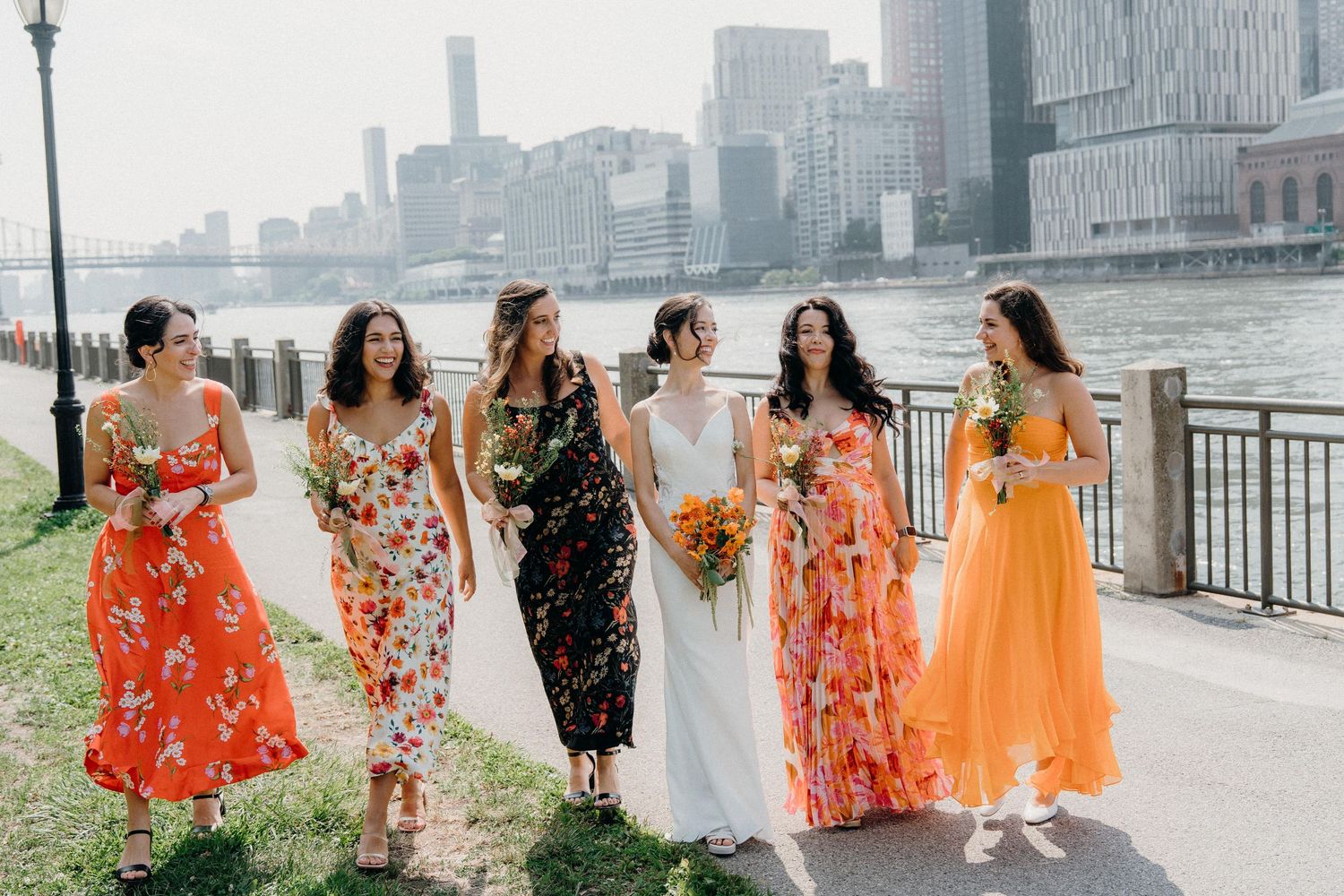 Bridal party wearing vibrant floral dresses at The Sanctuary Roosevelt Island