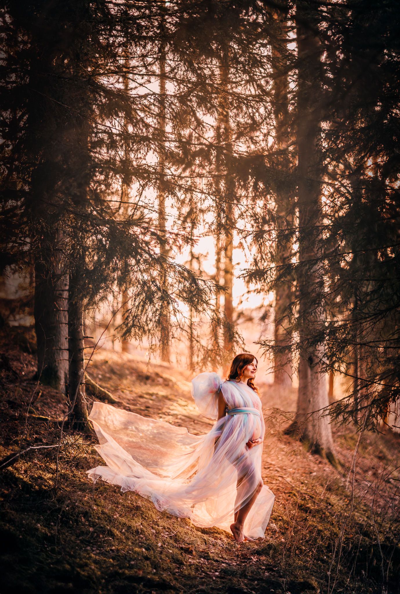 A figure in a flowing white dress stands in a misty forest at sunset with ethereal sunlight streaming through the trees.
