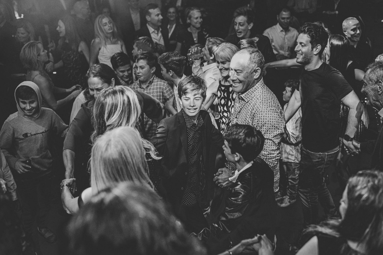 Black and white group shot of people dancing at a Los Angeles Bar Mitzvah event