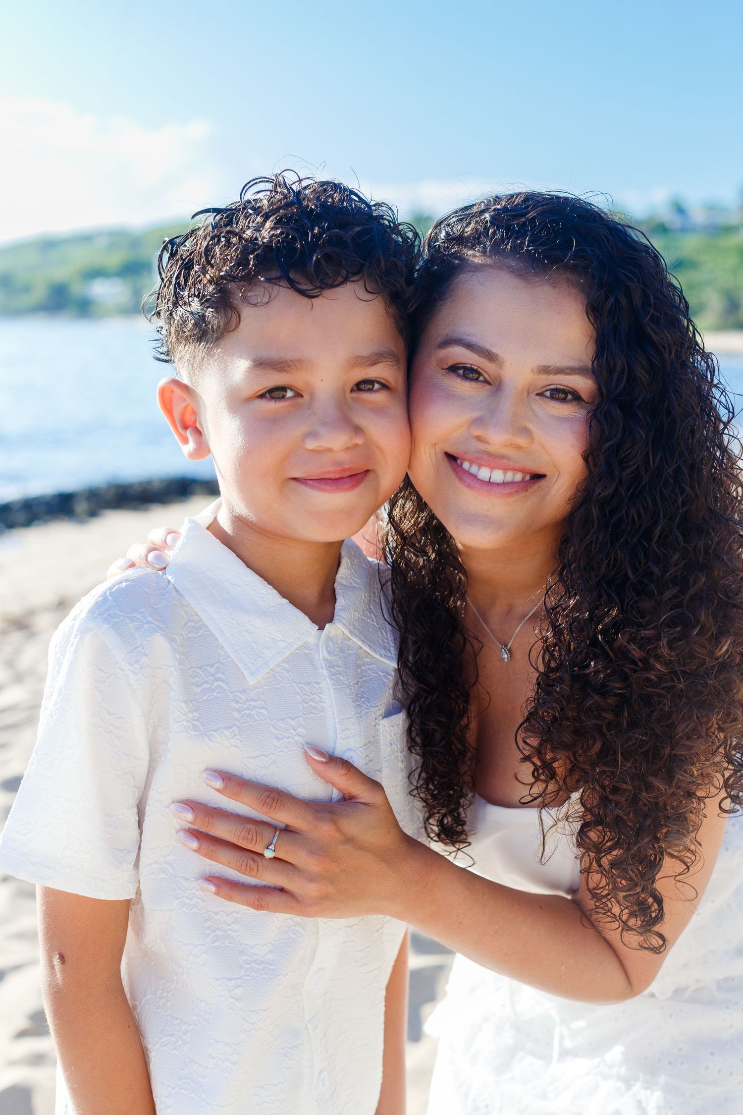 Family portrait on the beach. Mother and son. Playa Mar Chiquita, Puerto Rico.