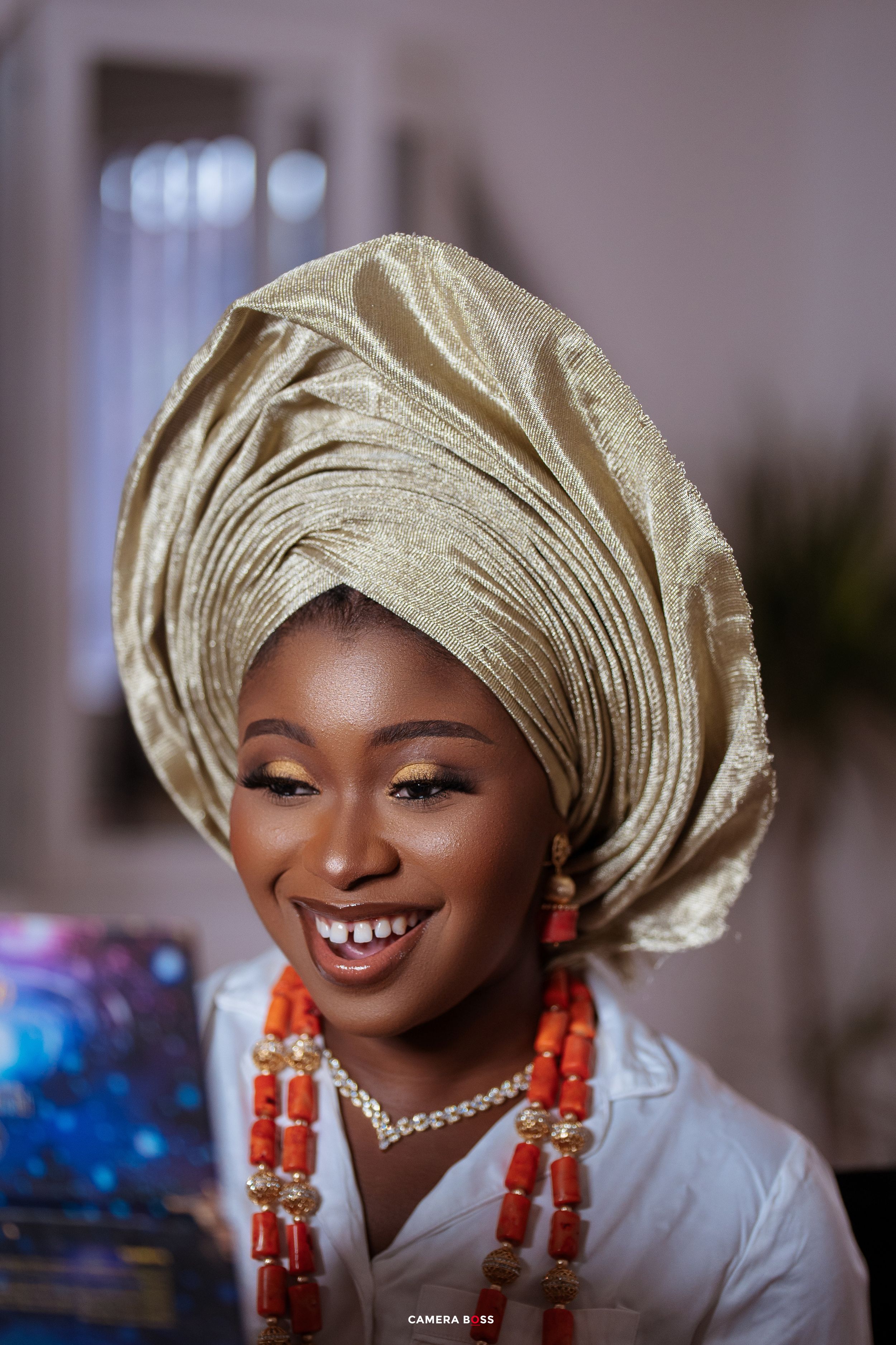 A series of elegant portrait shots showing traditional Nigerian gele headwrap and coral bead jewelry against an indoor setting.