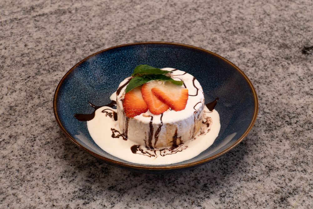 Elegant dessert plates featuring chocolate, fruit, and cream presentations.