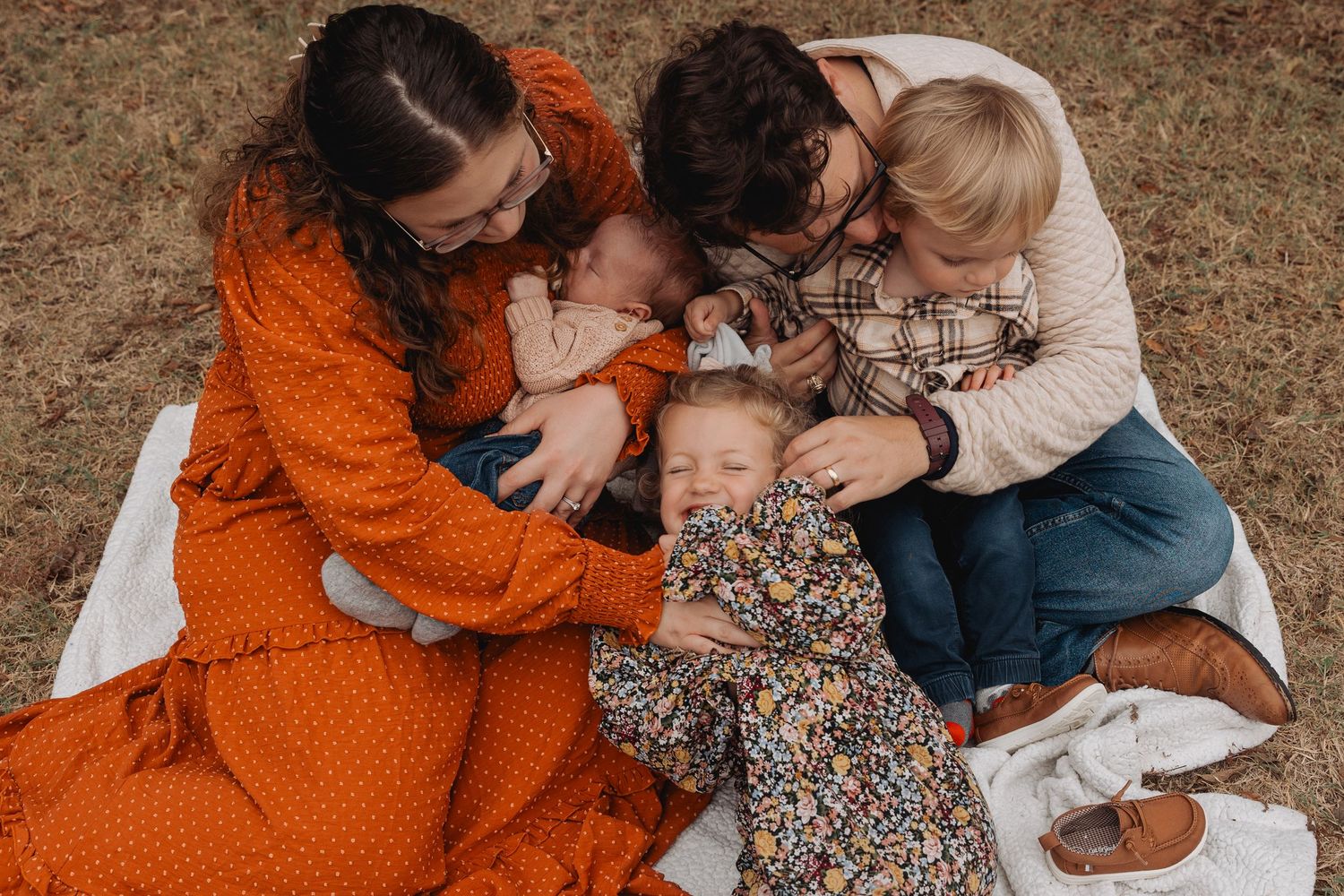 A series of tender family moments captured outdoors showing parents and baby in casual clothing.
