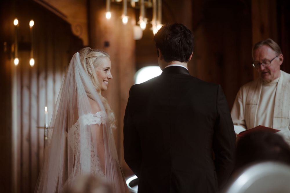 Traditional church wedding ceremony with candlelit ambiance.