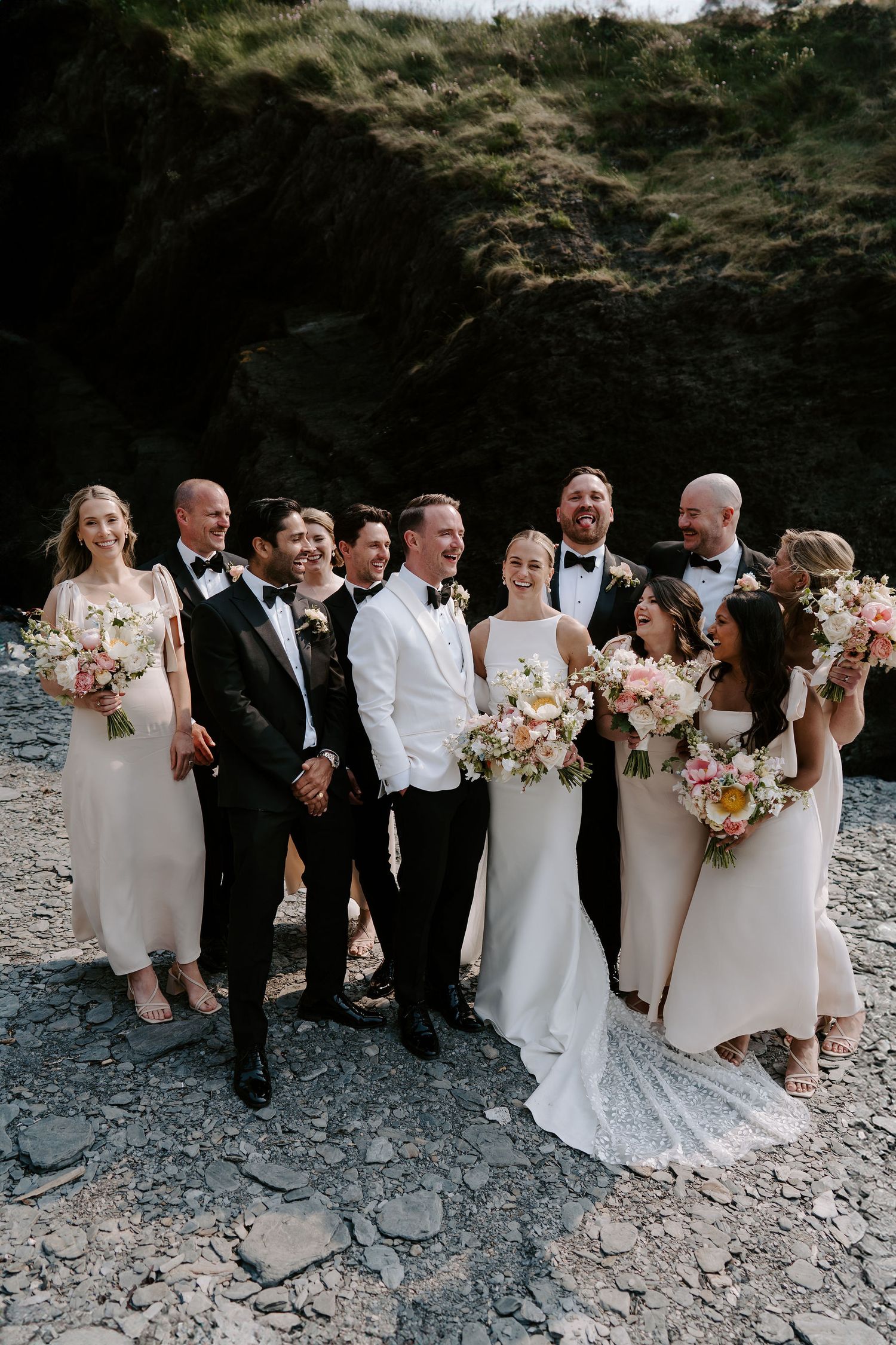 Bridal party on beach at Tunnels Beach wedding Venue in north Devon