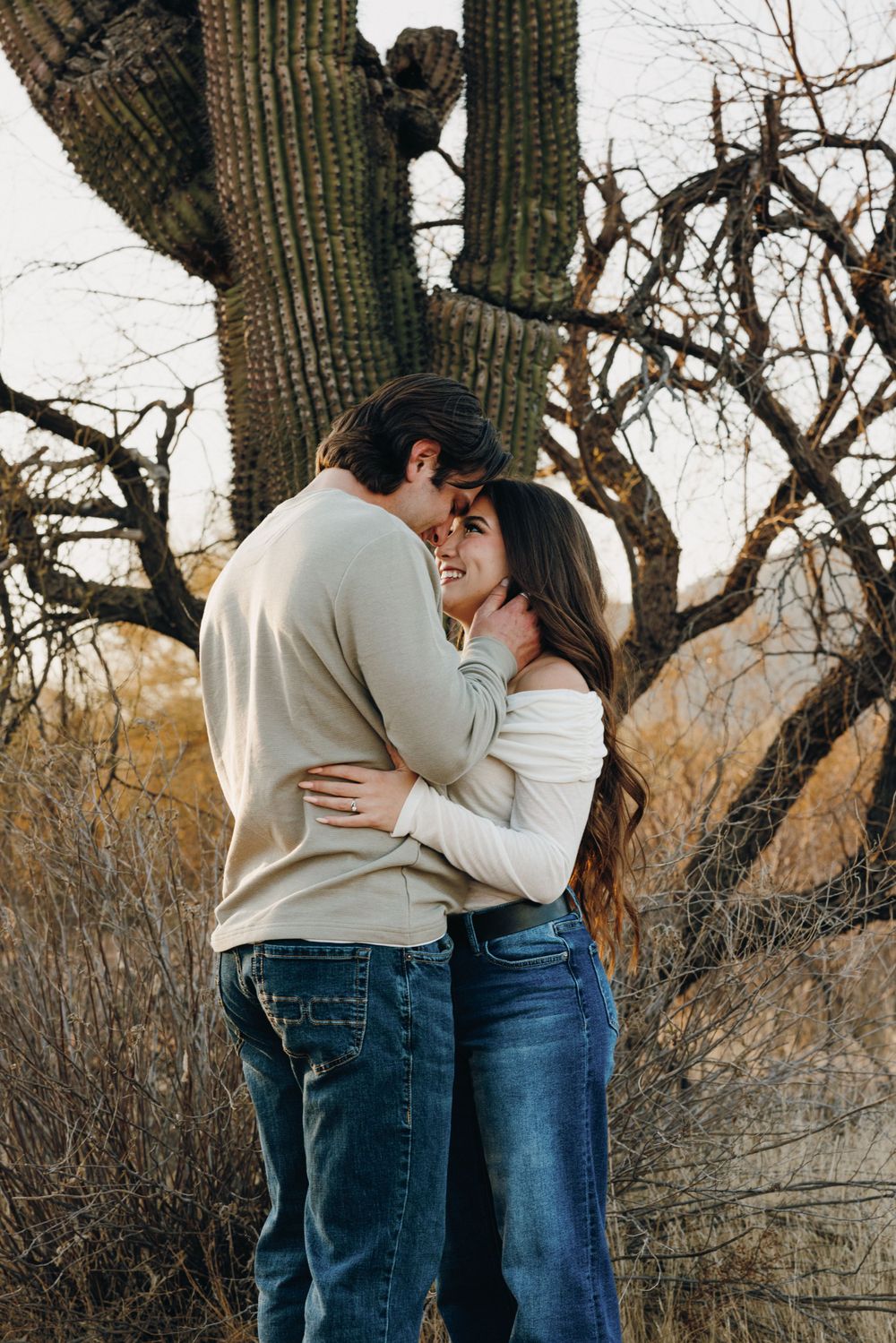 Sharing a kiss amongst the Saguaro cacti in Mesa Arizona.